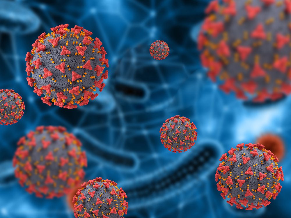 An illustration of seven coronavirus particles.